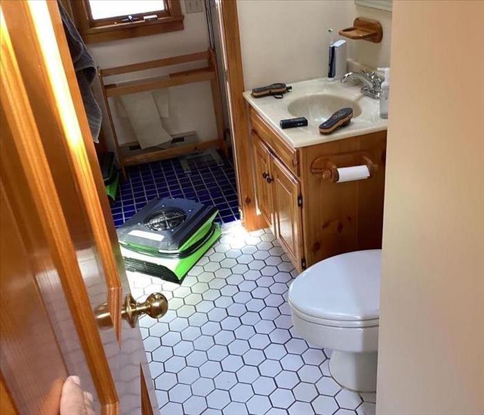 A bathroom has been restored after water damage.
