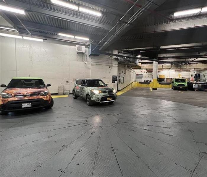 SERVPRO Vehicles in a parking garage.