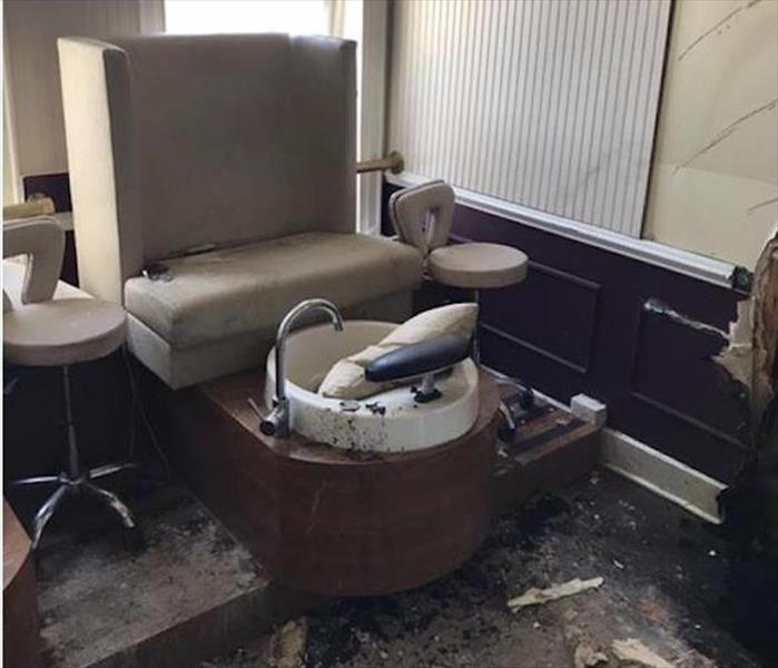 burned items on floor, sink and lounge in nail salon
