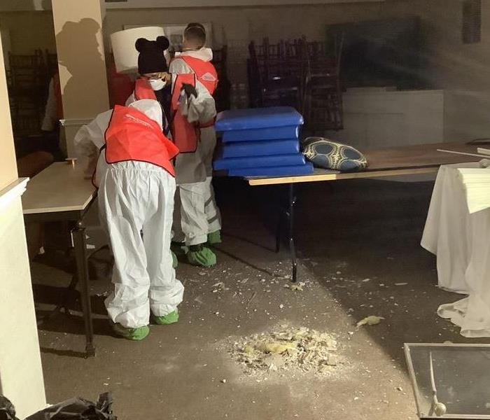 SERVPRO team members work to clean up after a disaster.
